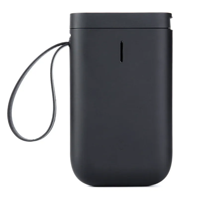 Compact black D11 Bluetooth thermal label printer on a desk next to a smartphone showing the label design app.