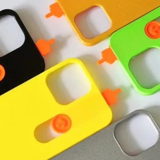 Bright yellow 3D printed sliding middle finger phone case for iPhone 14 Pro Max with spoof mechanism visible