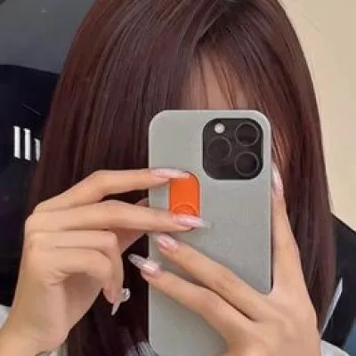 Bright yellow 3D printed sliding middle finger phone case for iPhone 14 Pro Max with spoof mechanism visible