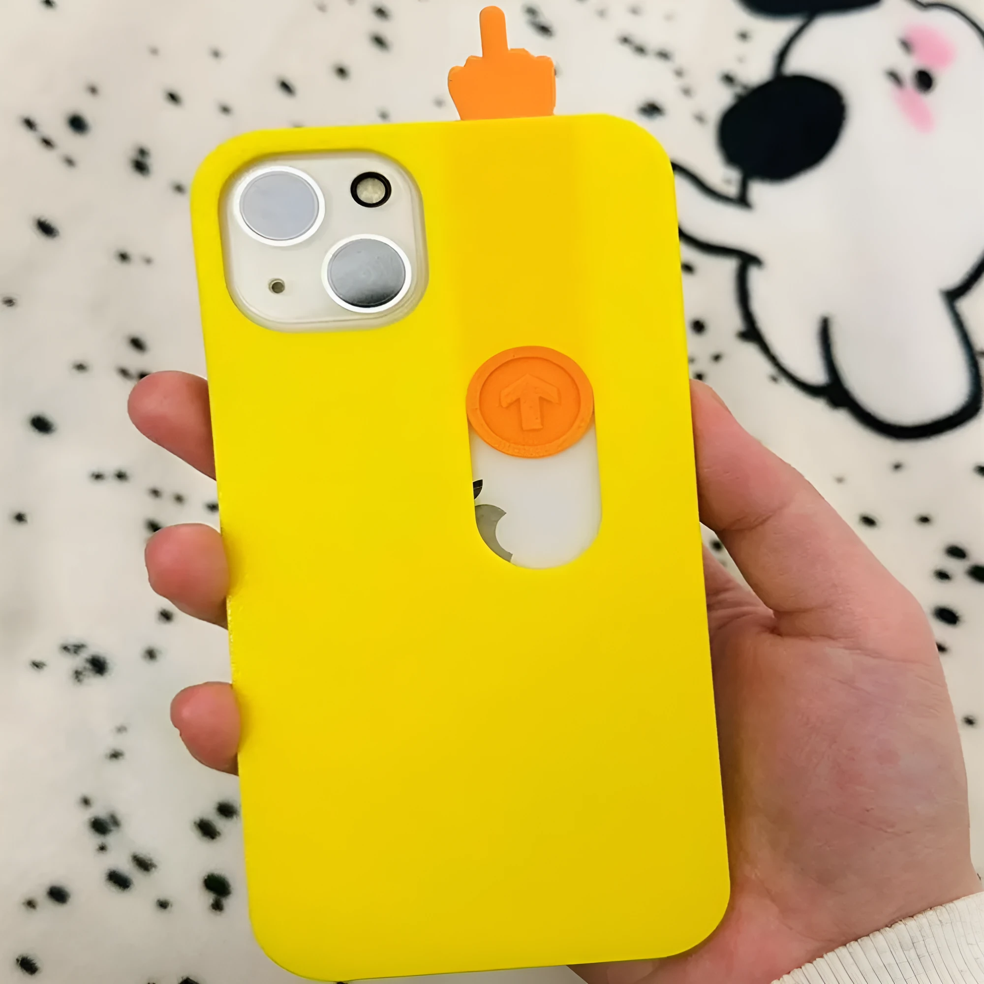 Bright yellow 3D printed sliding middle finger phone case for iPhone 14 Pro Max with spoof mechanism visible