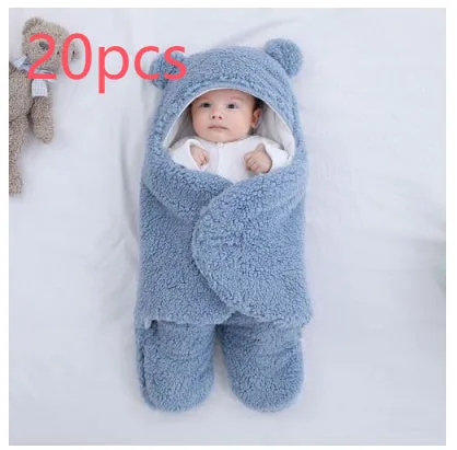Baby quilted sleeping bag wrapper in cotton blend fabric, shown in a light blue colour.