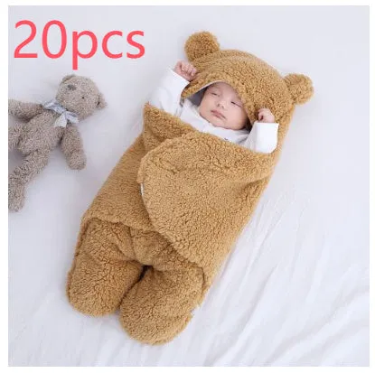 Baby quilted sleeping bag wrapper in cotton blend fabric, shown in a light blue colour.