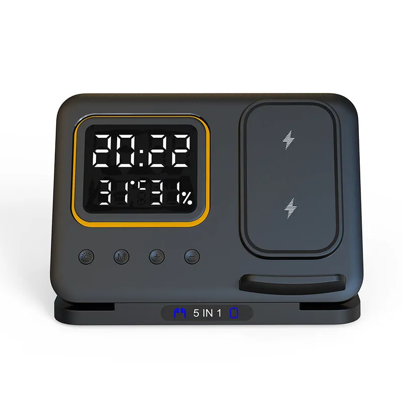 Black 5-in-1 wireless charging station displaying time and temperature, charging a phone and a smartwatch.