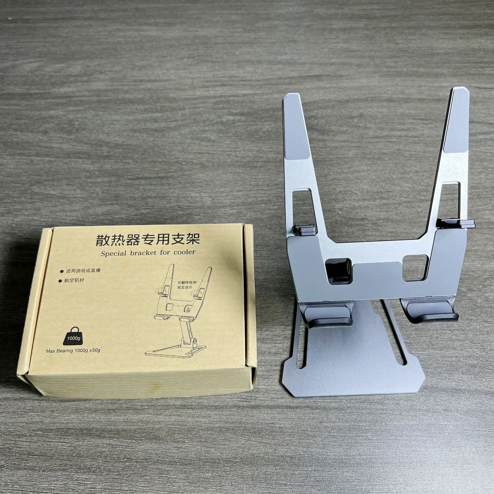 Creative desktop phone holder in aluminium alloy with radiator bracket, FZ01 style, on a desk