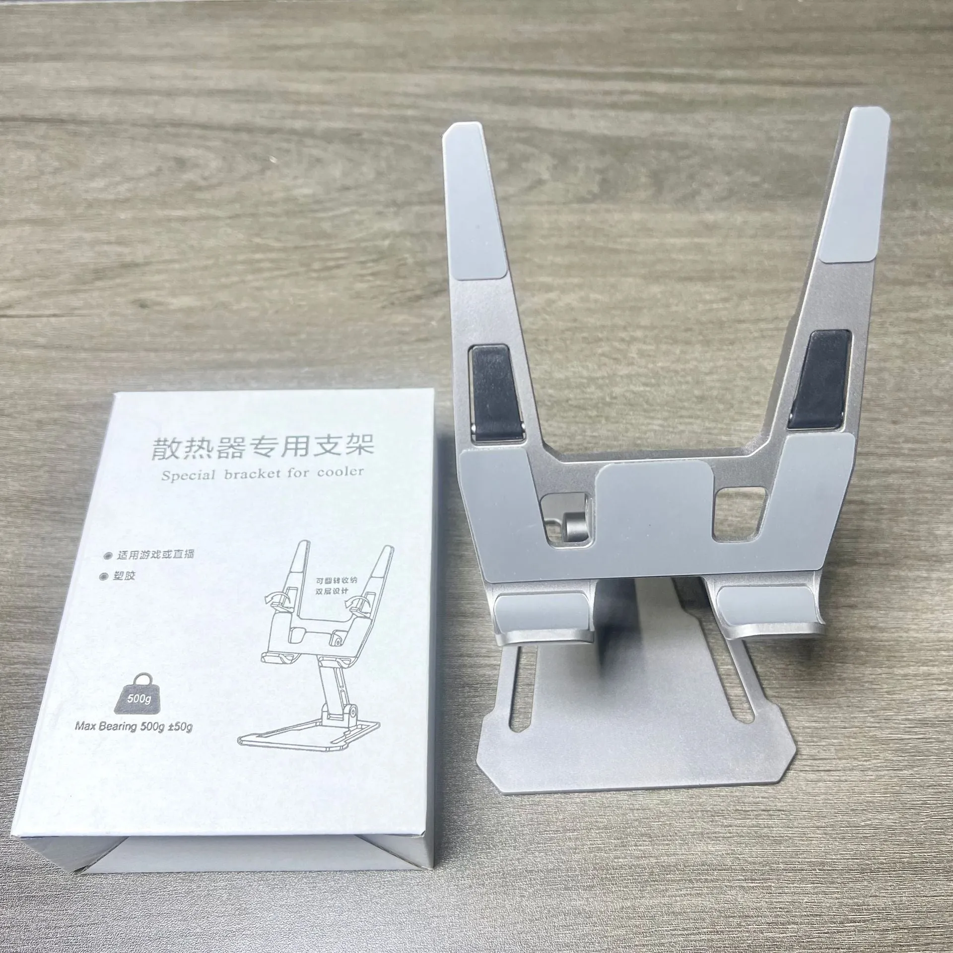 Creative desktop phone holder in aluminium alloy with radiator bracket, FZ01 style, on a desk