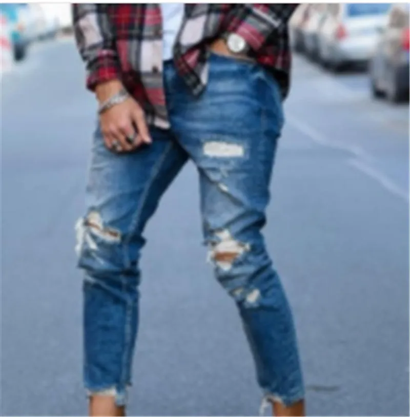 Men's distressed blue jeans with hole detailing in cotton fabric