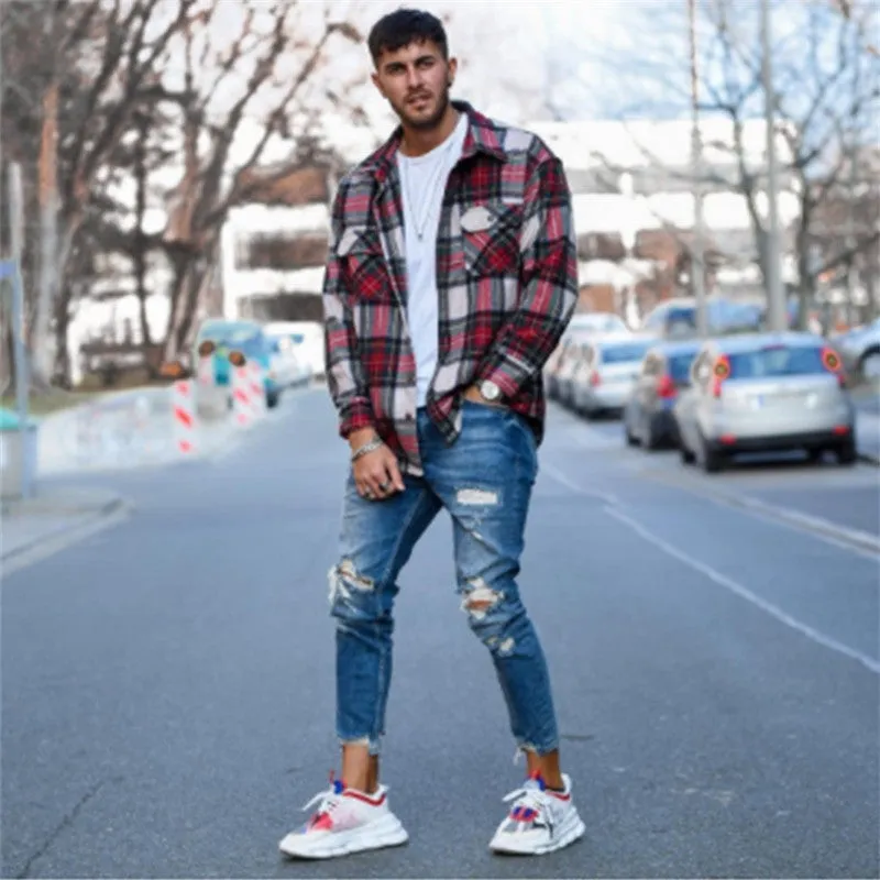 Men's distressed blue jeans with hole detailing in cotton fabric