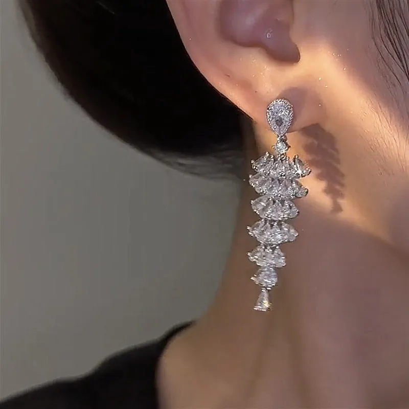 Women's silver pagoda Christmas tree drop earrings with sparkling zircon details on copper.