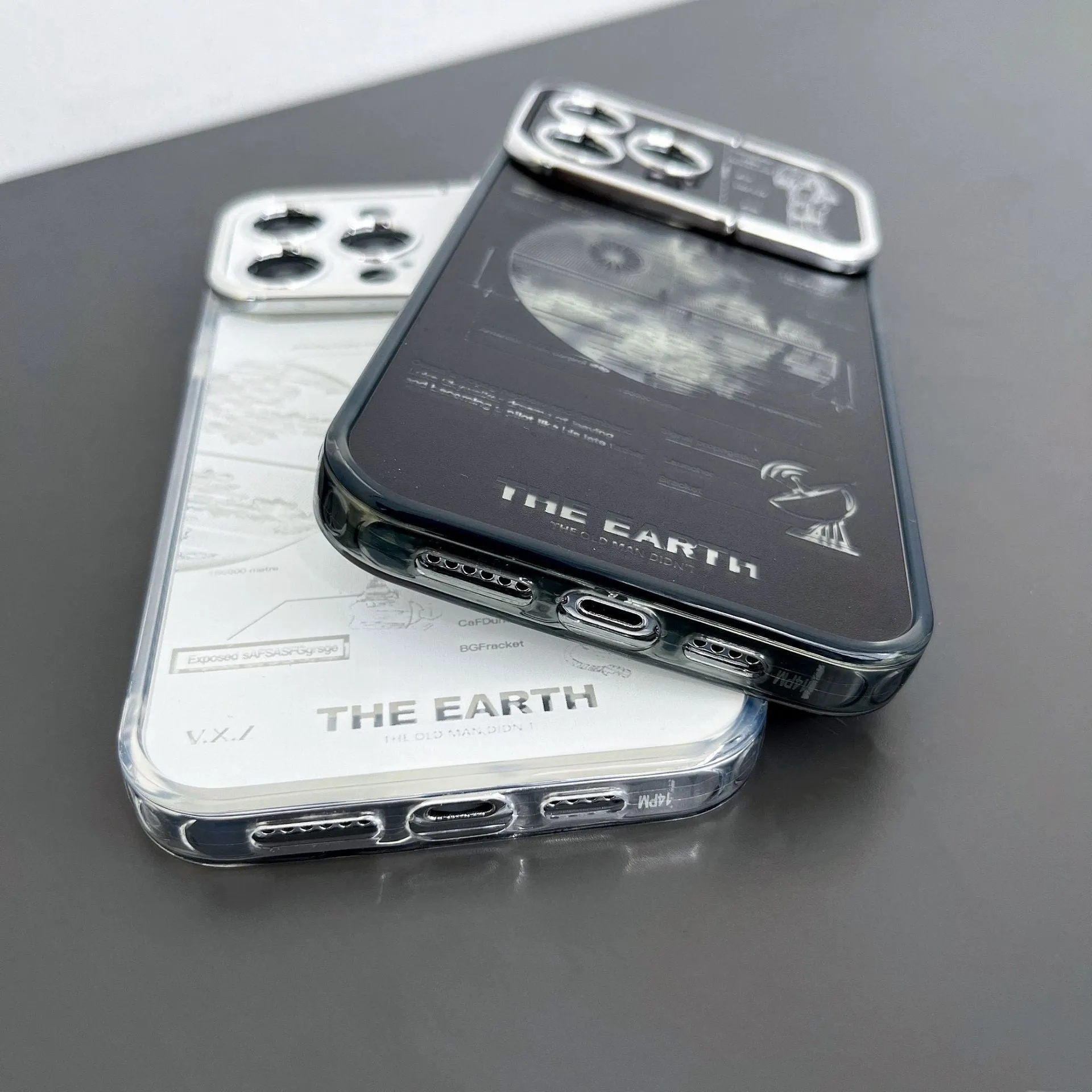 Pleated bracket TPU phone case with metal planet design for iPhone 14 Pro, two colour options shown