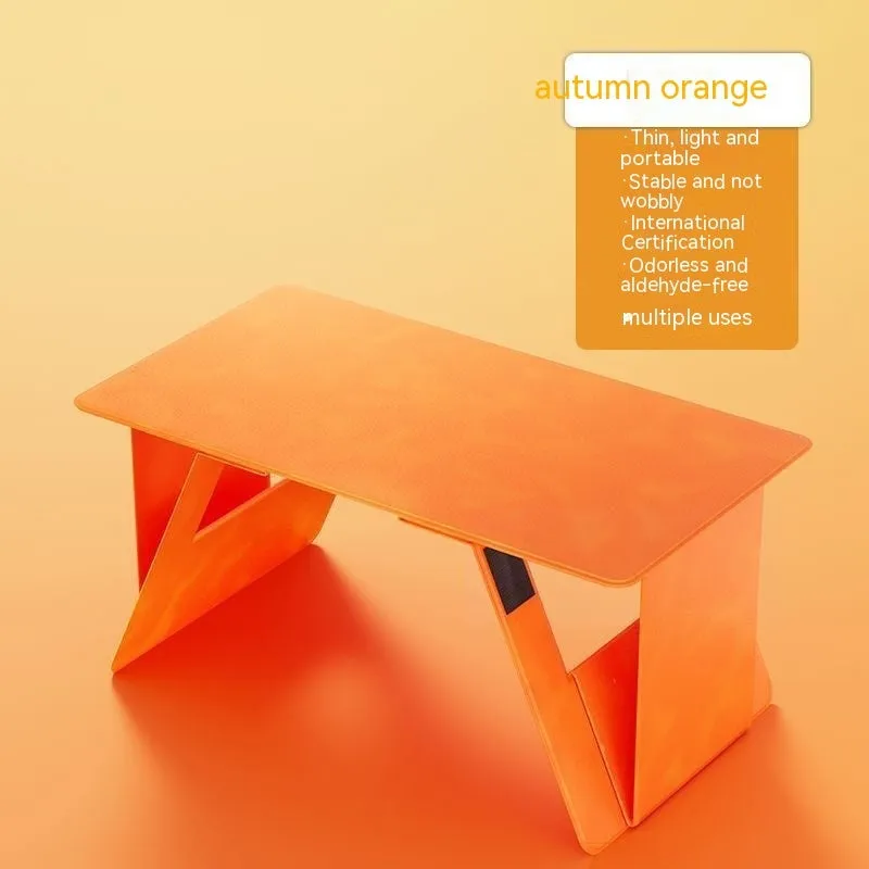Foldable wooden laptop tablet stand in black, standard size, with legs open on a flat surface