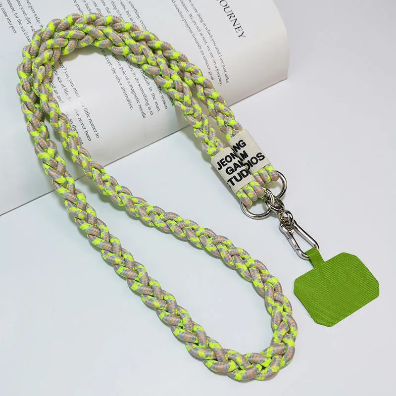Woven nylon crossbody phone lanyard with macaron pendant in Pink Dot Gray, showing three-strand horse tail detail and matching clip.