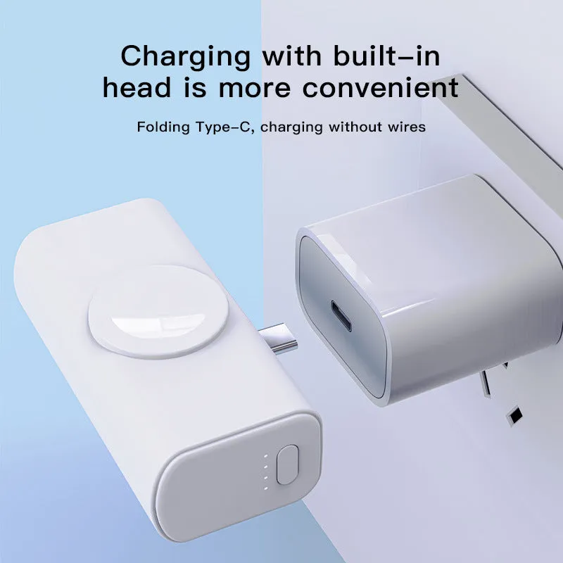 Portable 5000mAh power bank with folding double head charger, compact capsule design in black plastic