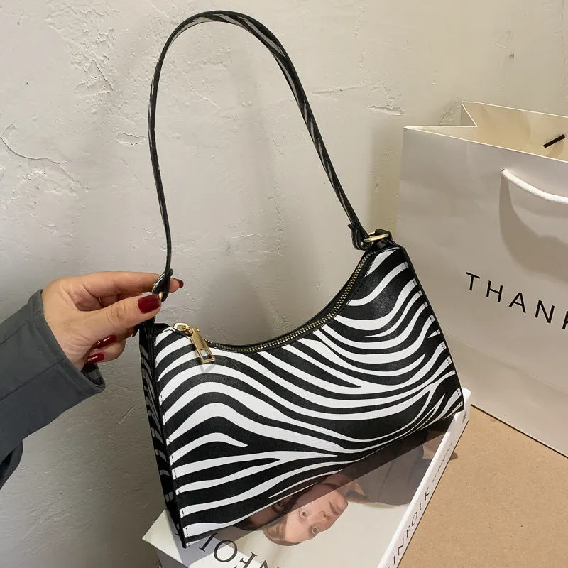Women's small square PU underarm bag in multiple colours including leopard print, beige, and black.