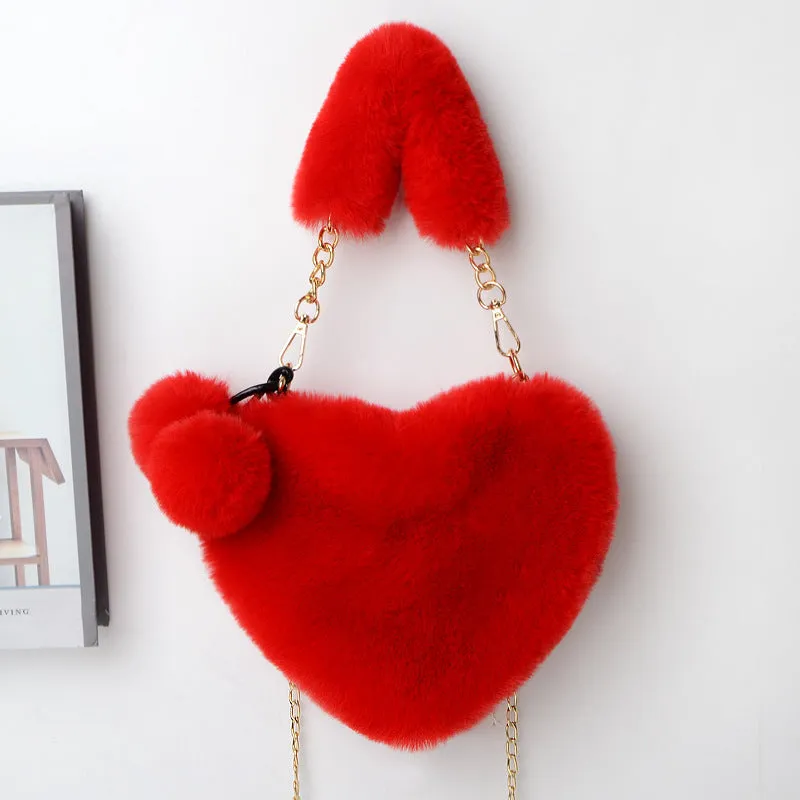 Women's soft plush heart-shaped handbag in medium size with adjustable shoulder strap