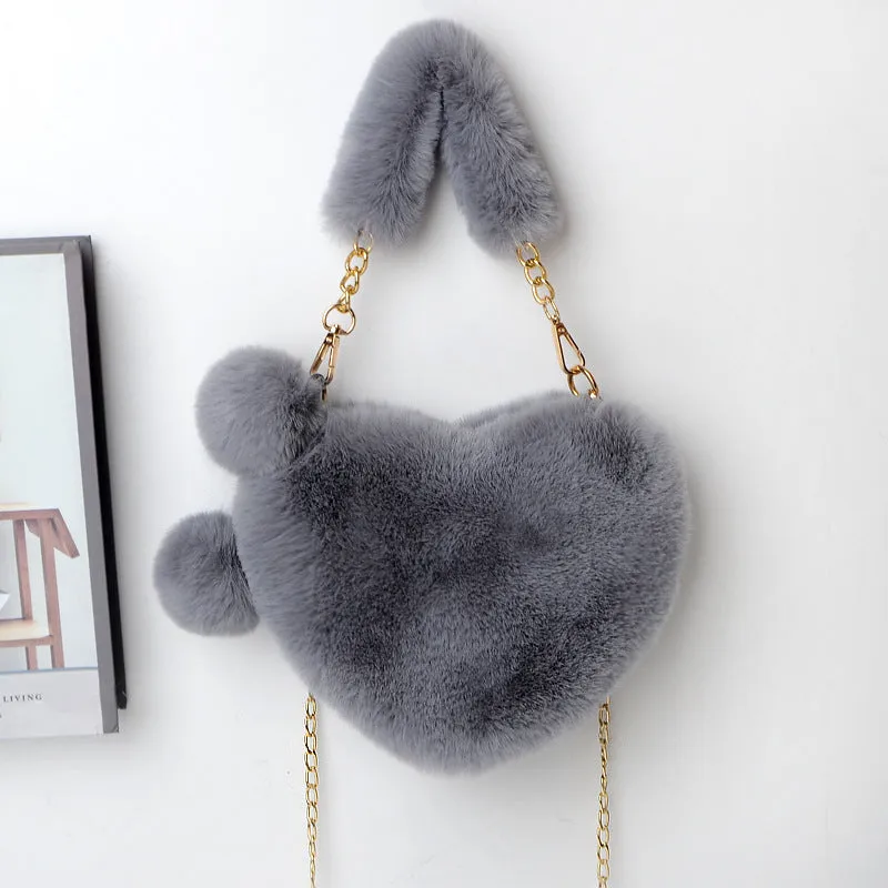 Women's soft plush heart-shaped handbag in medium size with adjustable shoulder strap