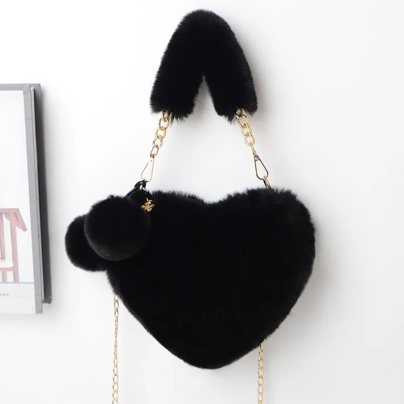 Women's soft plush heart-shaped handbag in medium size with adjustable shoulder strap