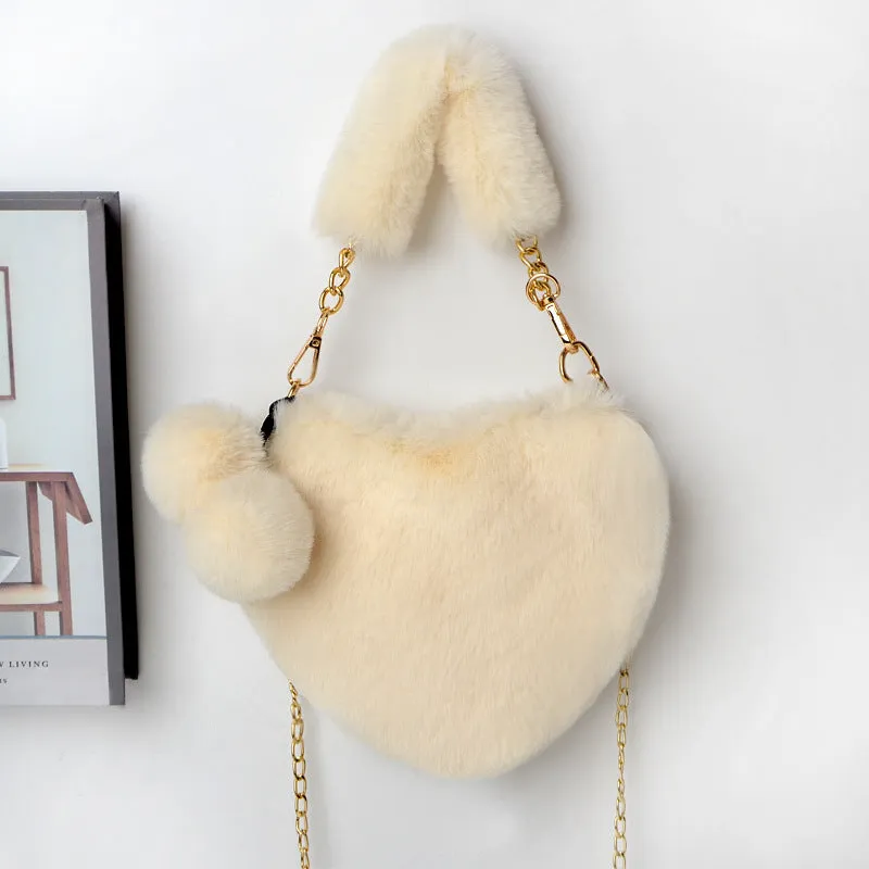 Women's soft plush heart-shaped handbag in medium size with adjustable shoulder strap