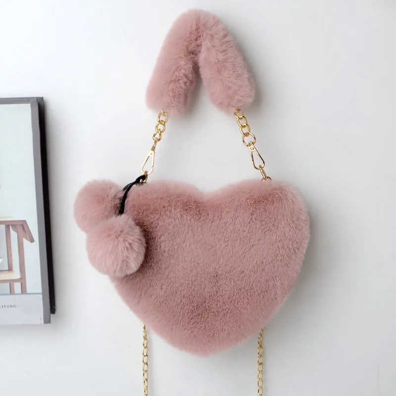 Women's soft plush heart-shaped handbag in medium size with adjustable shoulder strap