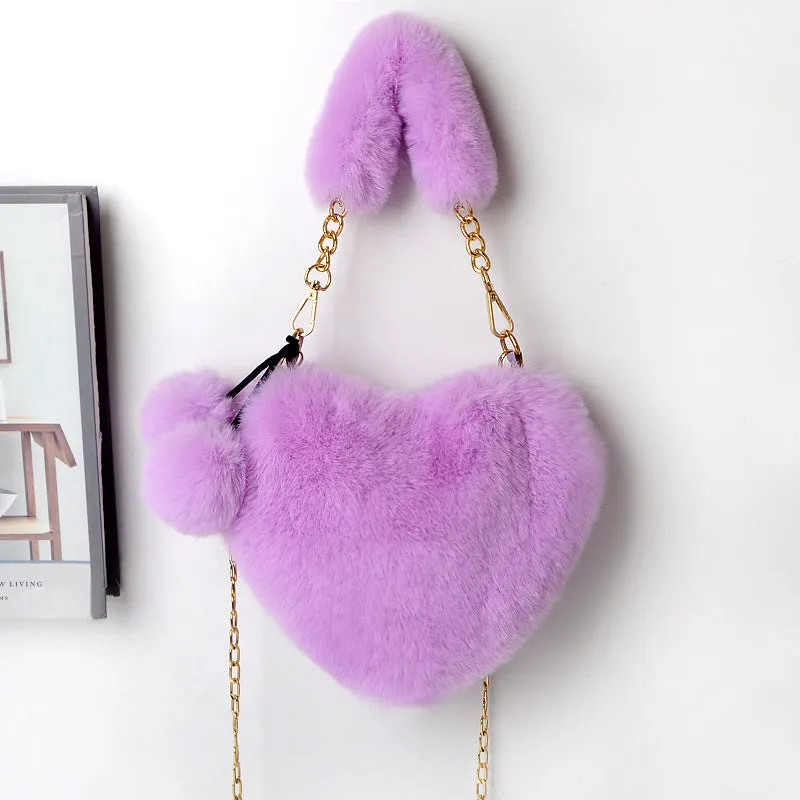 Women's soft plush heart-shaped handbag in medium size with adjustable shoulder strap