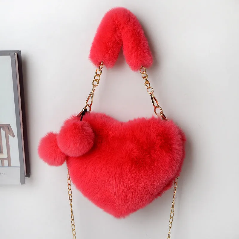 Women's soft plush heart-shaped handbag in medium size with adjustable shoulder strap