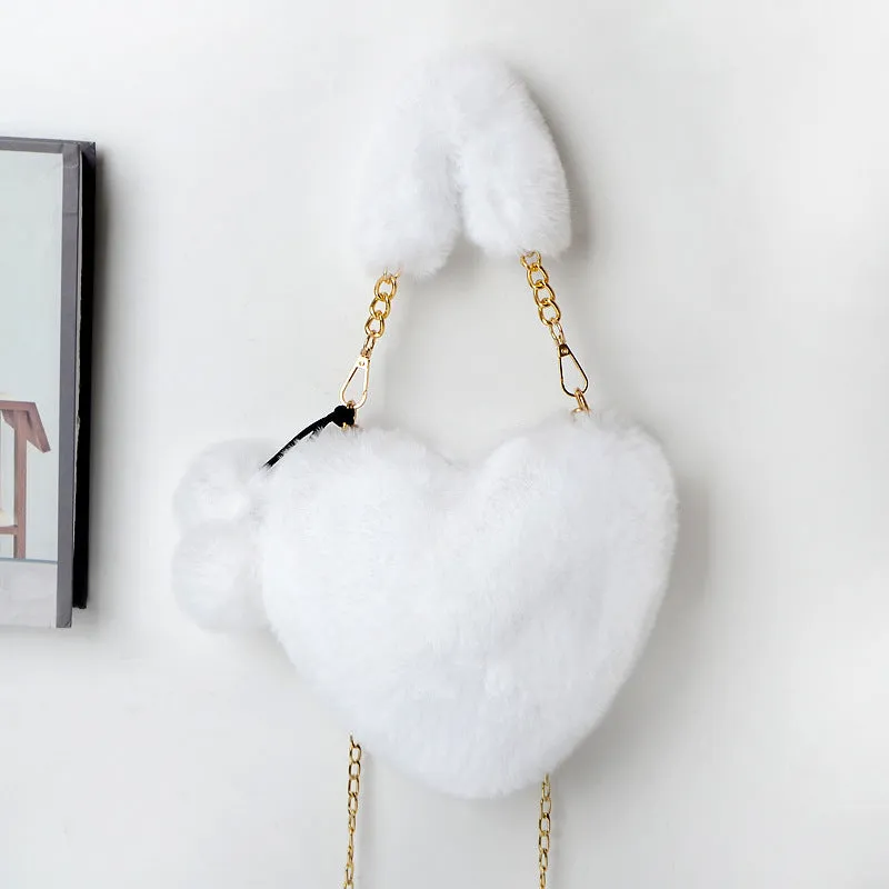 Women's soft plush heart-shaped handbag in medium size with adjustable shoulder strap