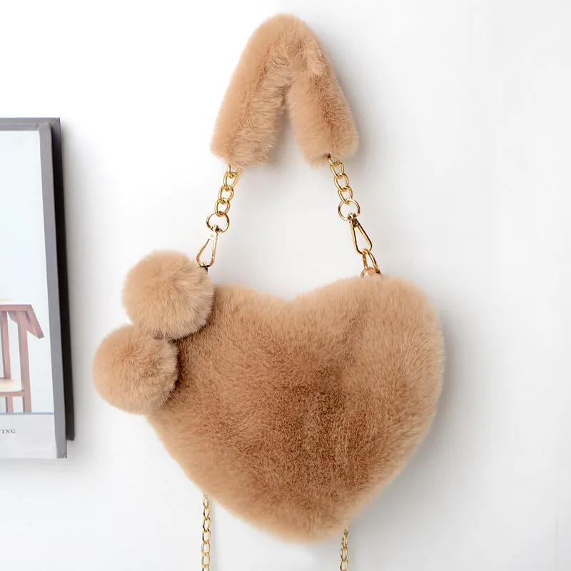 Women's soft plush heart-shaped handbag in medium size with adjustable shoulder strap