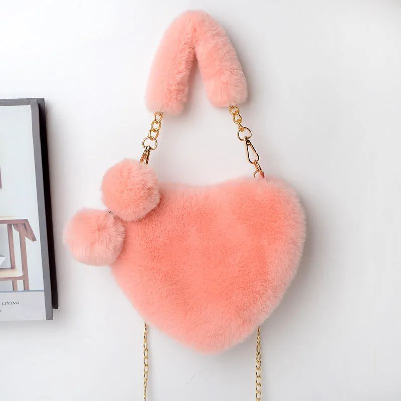 Women's soft plush heart-shaped handbag in medium size with adjustable shoulder strap