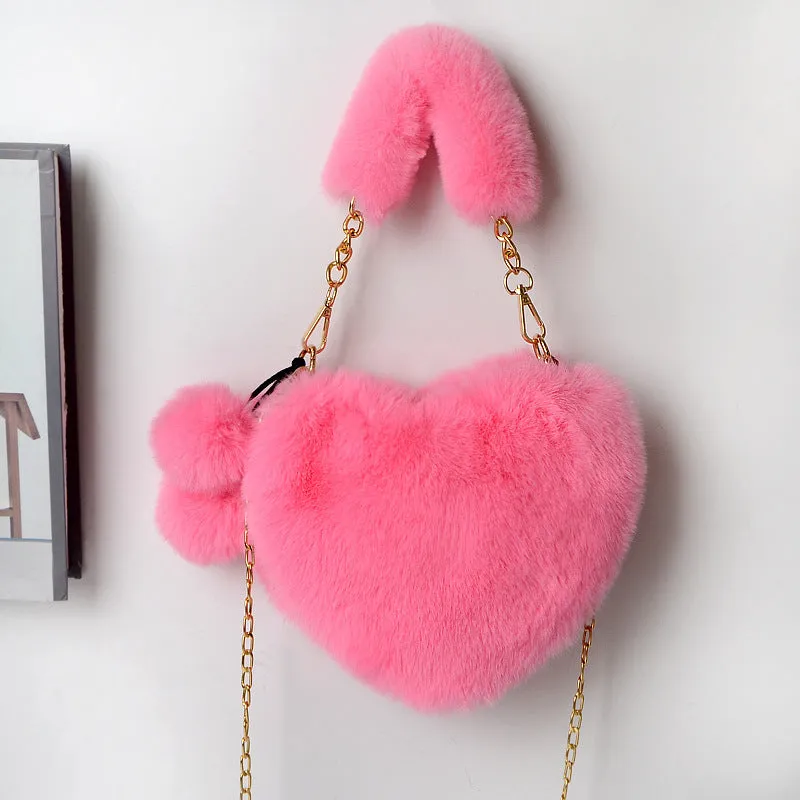 Women's soft plush heart-shaped handbag in medium size with adjustable shoulder strap