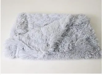 Soft long plush dog blanket in light grey, shown folded with size options S, M, L.
