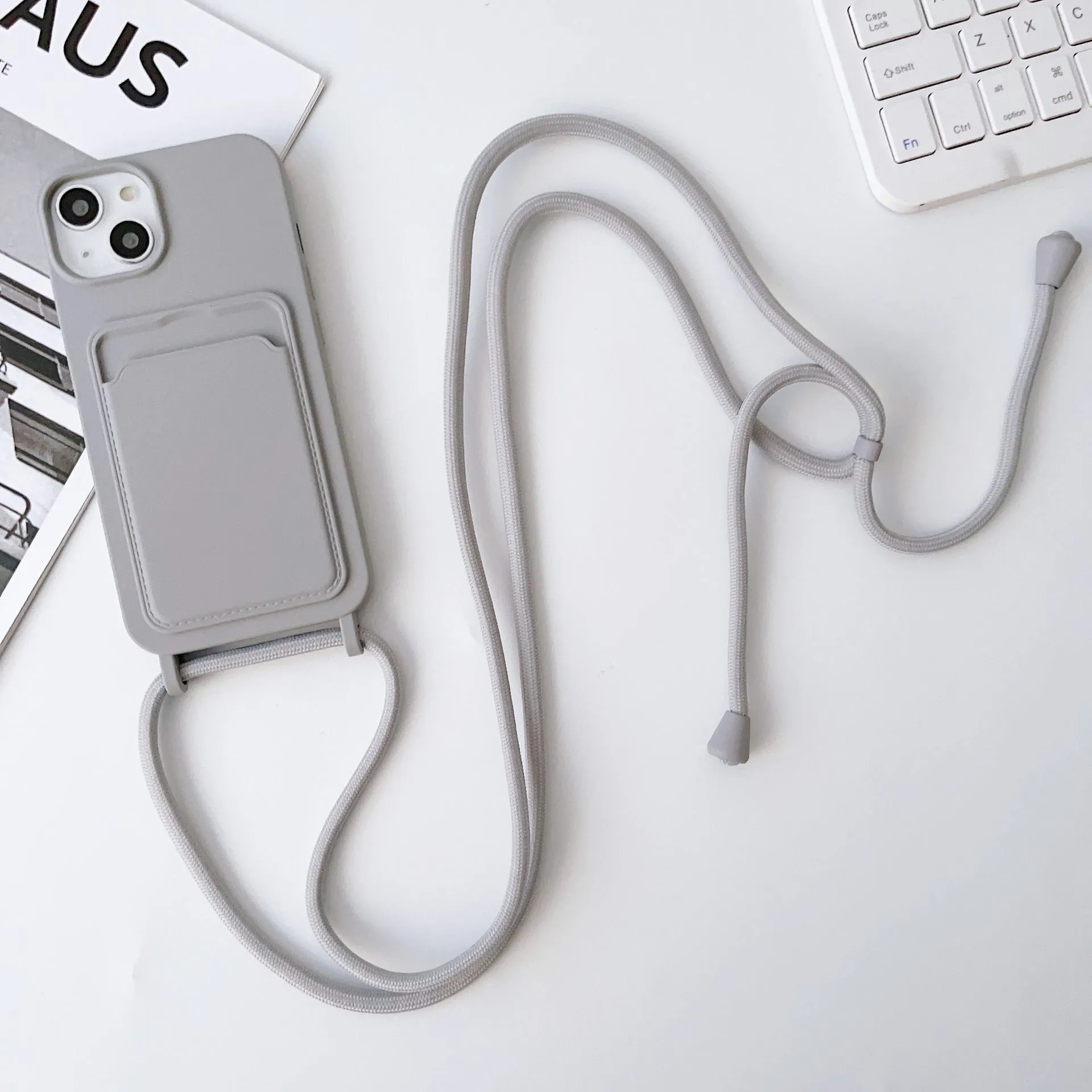 Cross body lanyard TPU phone case with card holder for Apple iPhone models, available in antique white, gray, and light pink