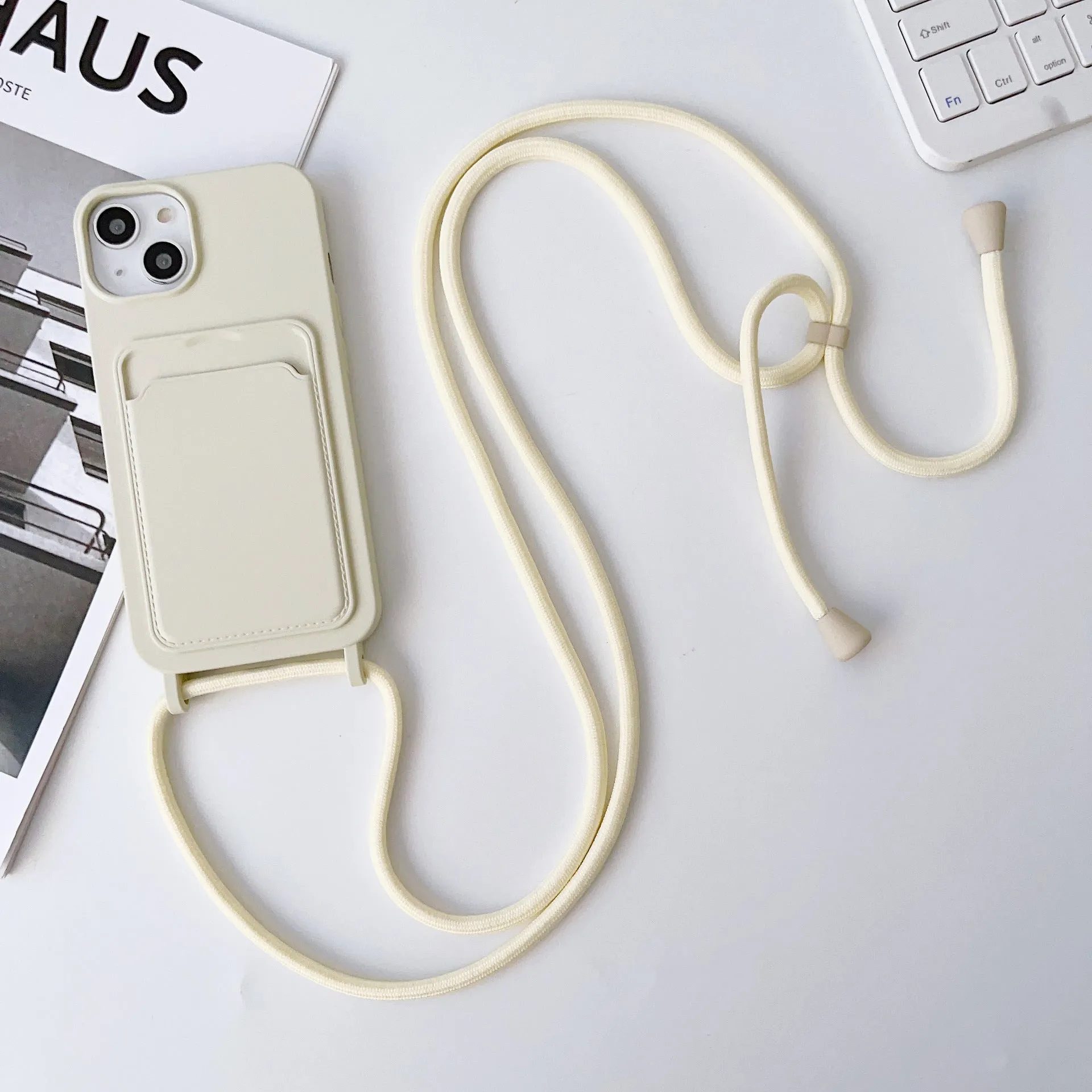 Cross body lanyard TPU phone case with card holder for Apple iPhone models, available in antique white, gray, and light pink