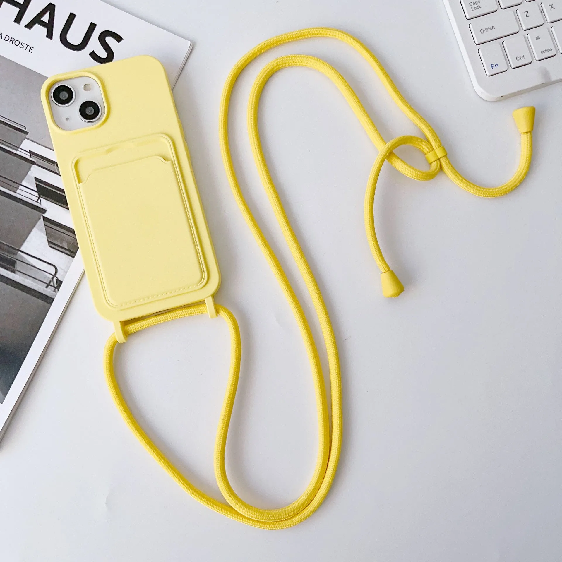 Cross body lanyard TPU phone case with card holder for Apple iPhone models, available in antique white, gray, and light pink