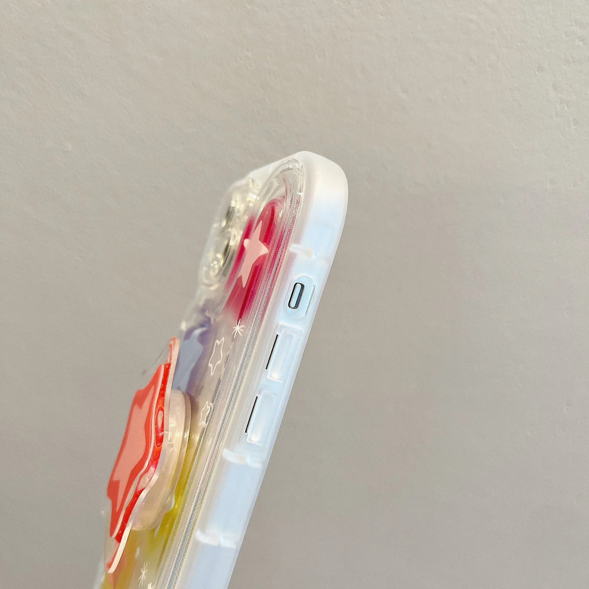 Blooming color TPU phone case with built-in bracket on an iPhone, showing airbag edge design