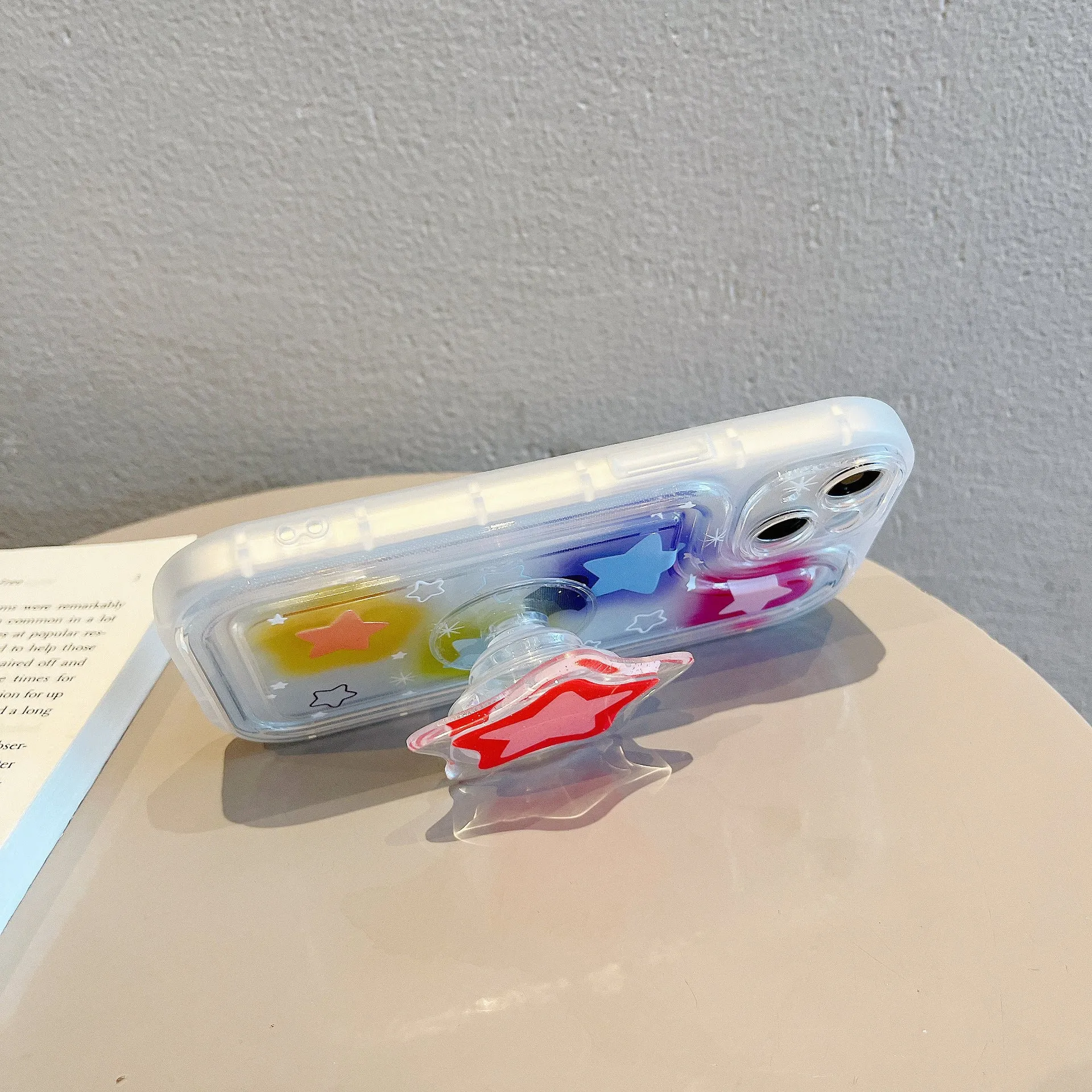 Blooming color TPU phone case with built-in bracket on an iPhone, showing airbag edge design