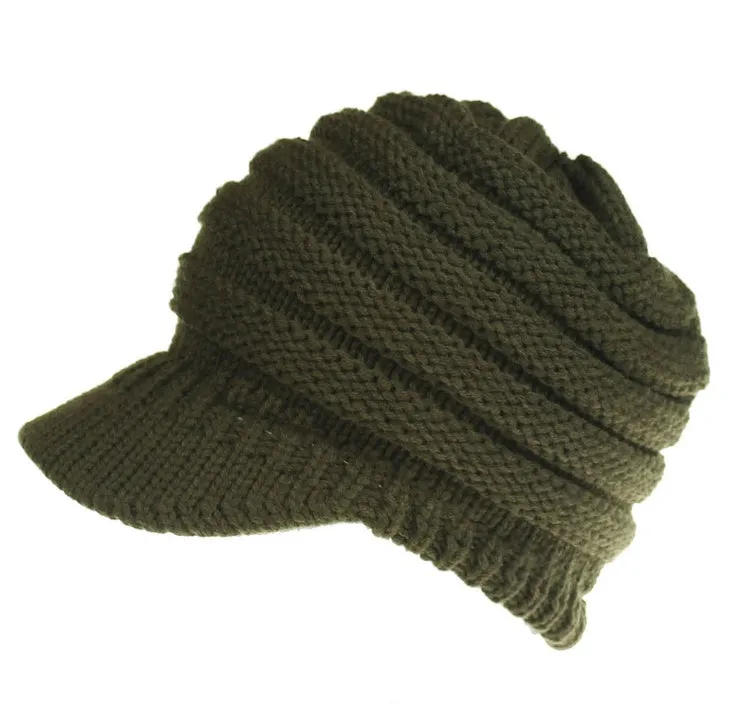 Acrylic knitted ponytail beanie hat for women in a neutral colour, shown on a model with a high ponytail.
