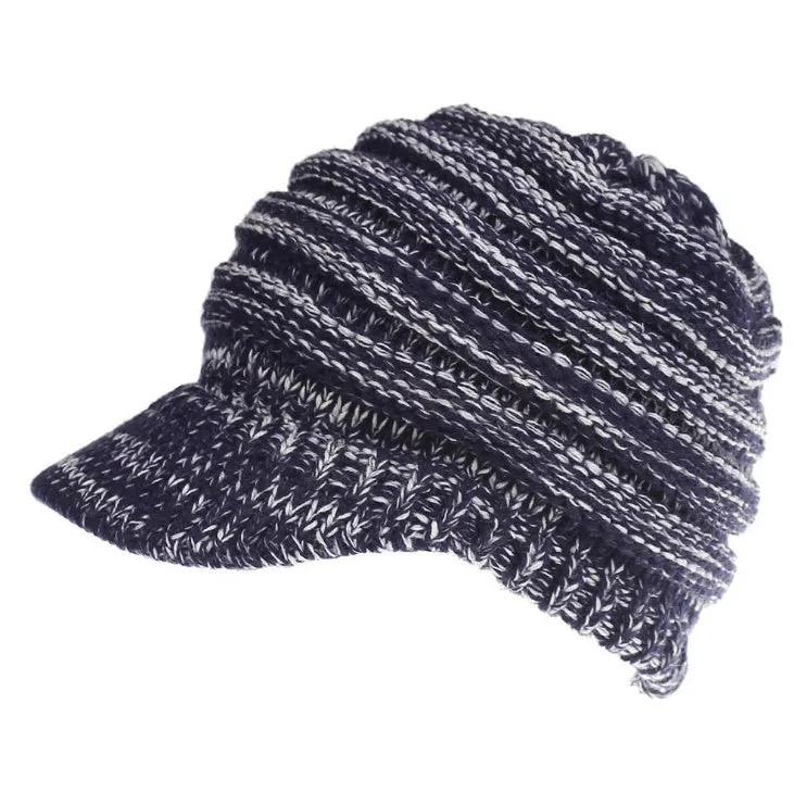 Acrylic knitted ponytail beanie hat for women in a neutral colour, shown on a model with a high ponytail.