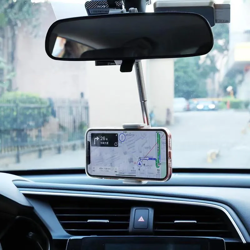 Black ABS plastic mobile phone bracket mounted on car rearview mirror showing smartphone in holder