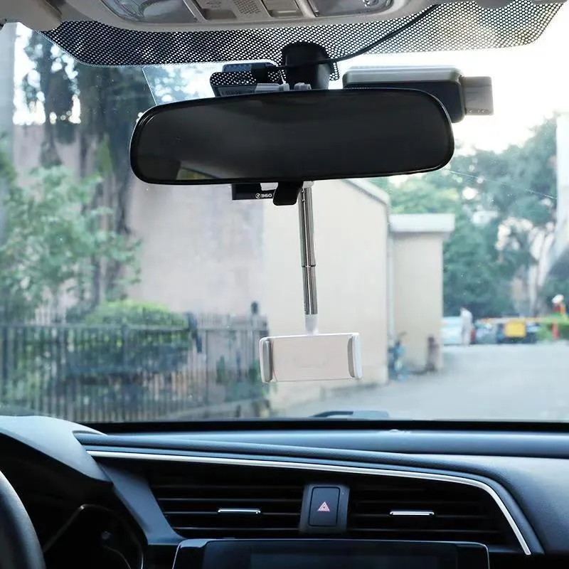 Black ABS plastic mobile phone bracket mounted on car rearview mirror showing smartphone in holder