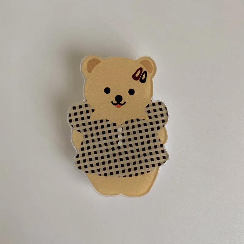 White epoxy resin Brown Bear series phone bracket with bear holding flower design on desk
