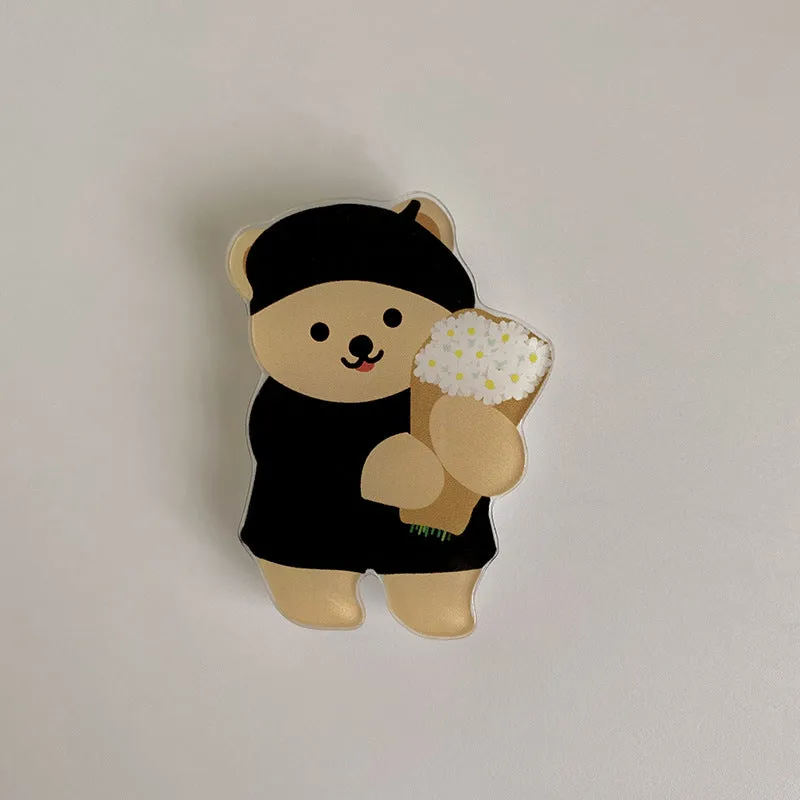 White epoxy resin Brown Bear series phone bracket with bear holding flower design on desk