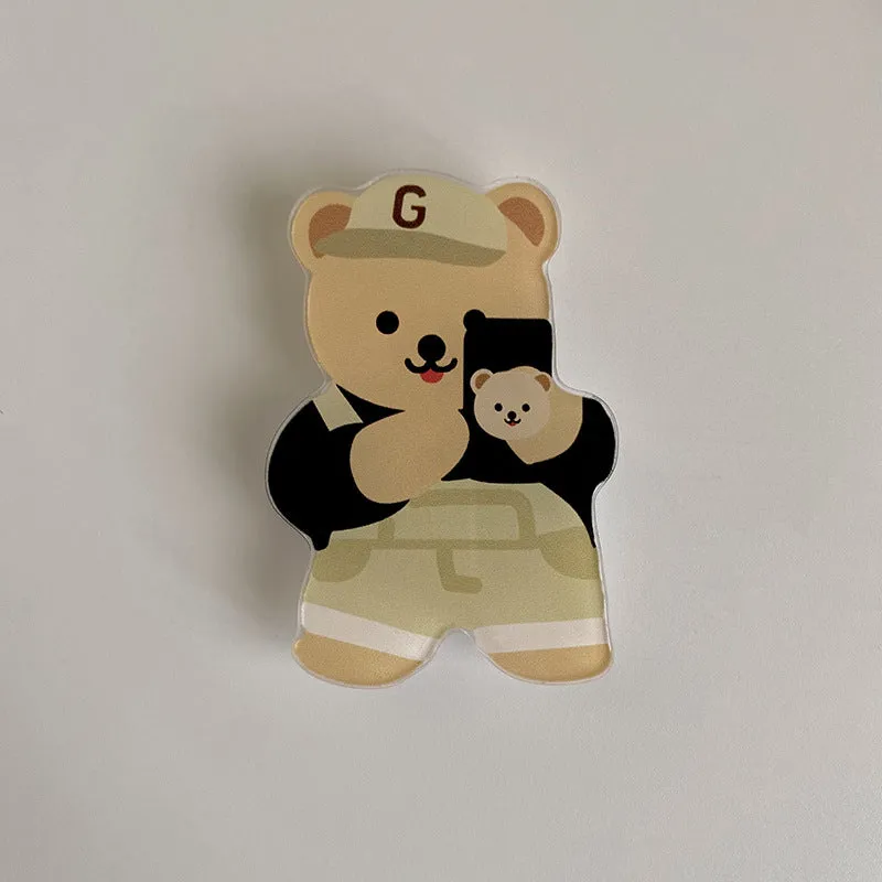 White epoxy resin Brown Bear series phone bracket with bear holding flower design on desk