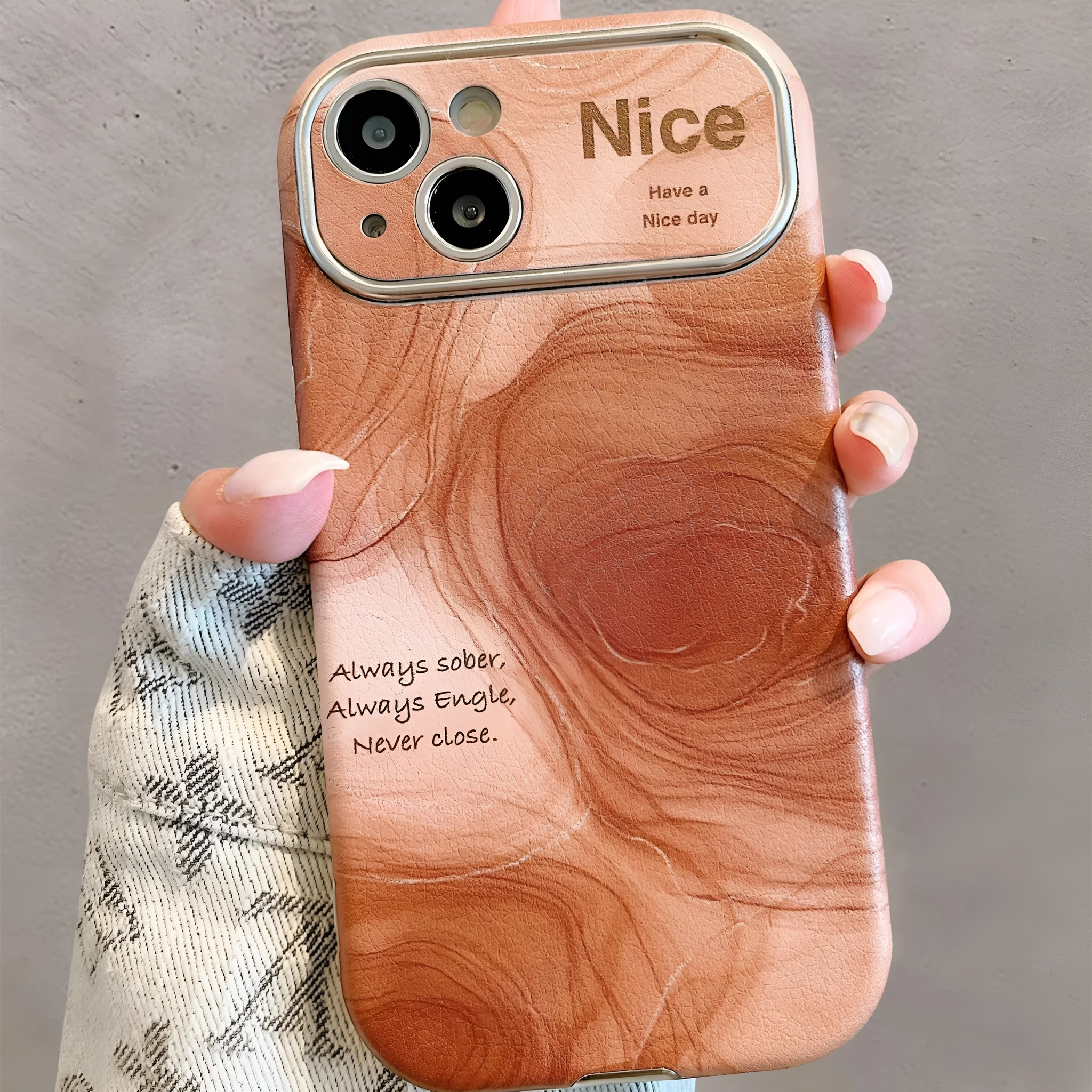 Large window lambskin silicone phone case in coffee colour with three-dimensional relief pattern compatible with iPhone