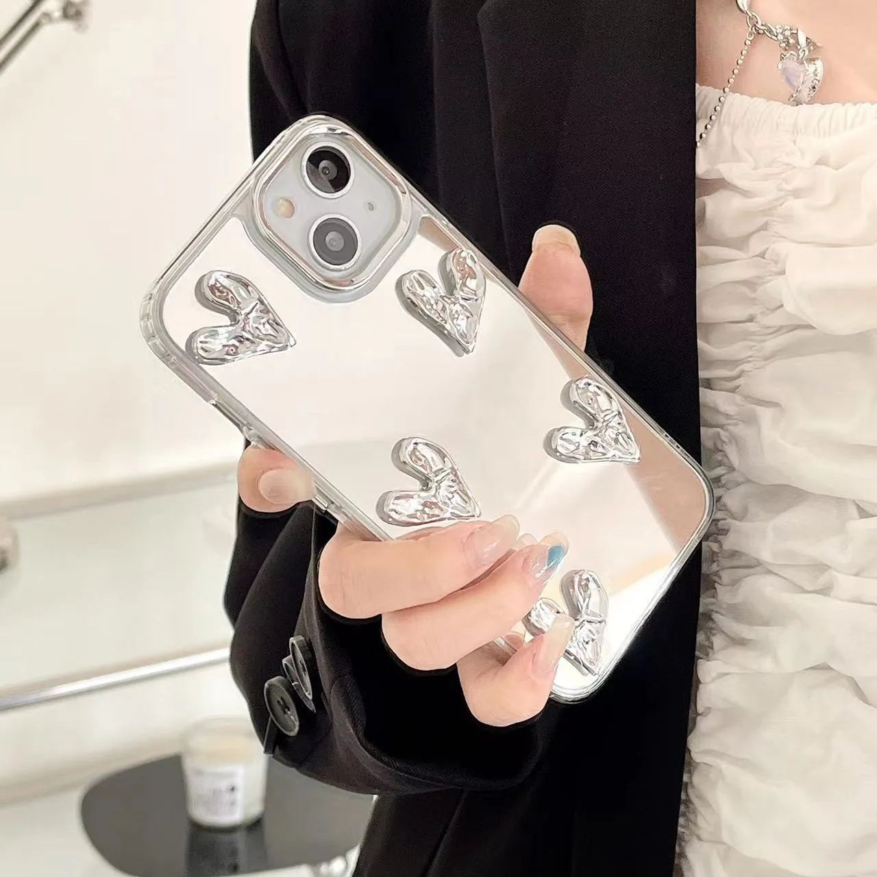 White electroplated mirror phone case for iPhone 14 Pro Max with three-dimensional love pattern and soft TPU construction