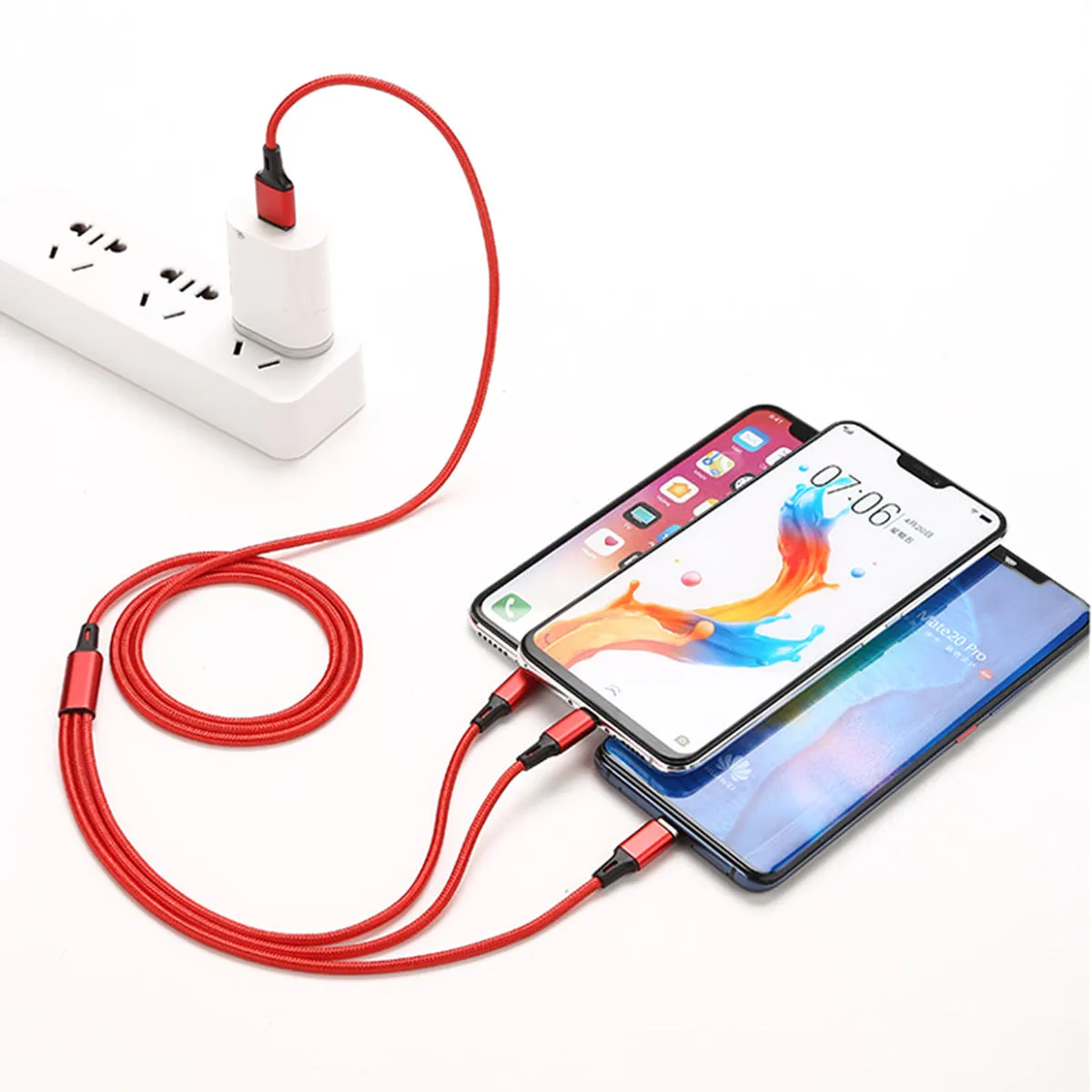 Red nylon woven three-in-one data cable with Lightning, Micro USB, and Type-C connectors on white background