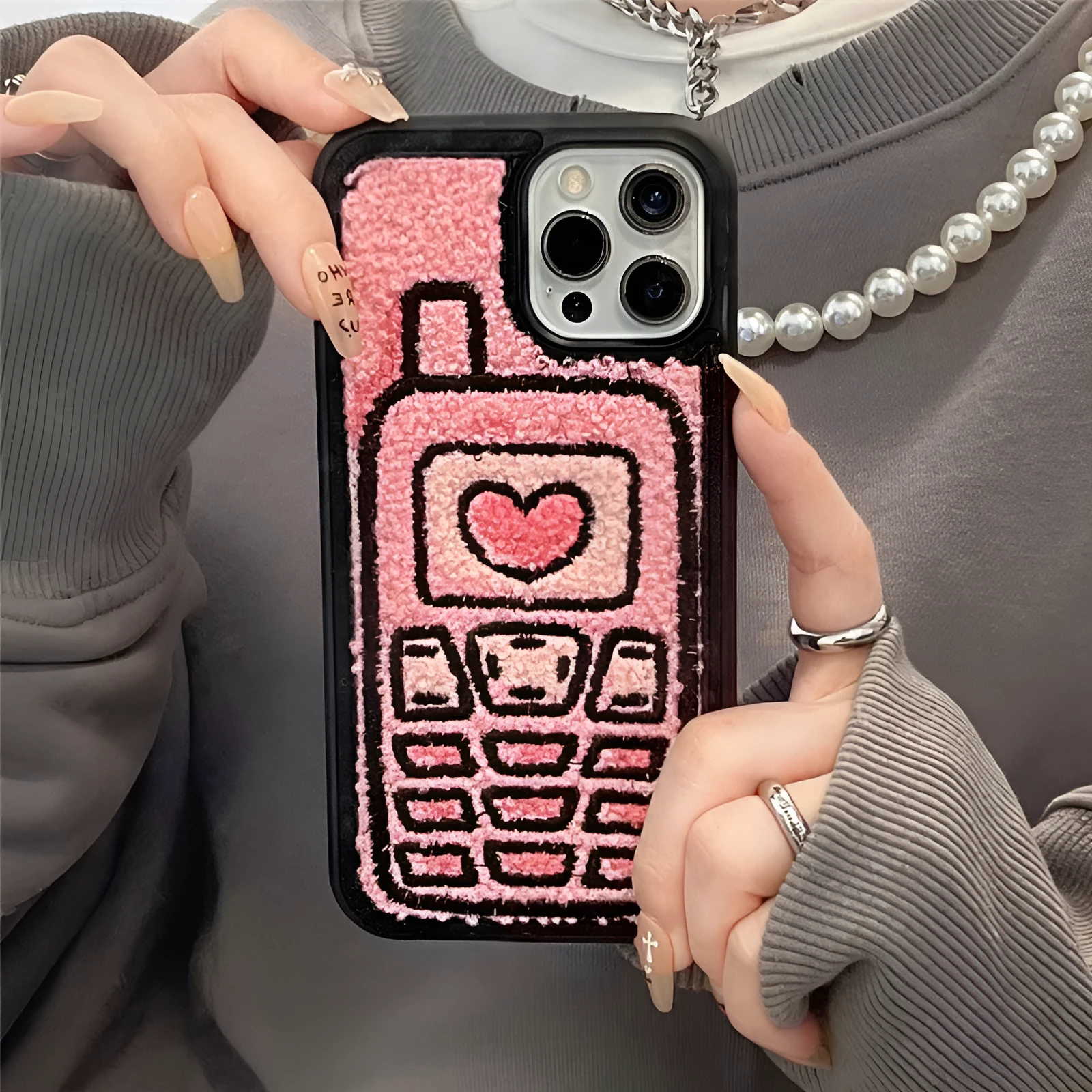 Pink TPU iPhone back cover case with a textured towel embroidery design.