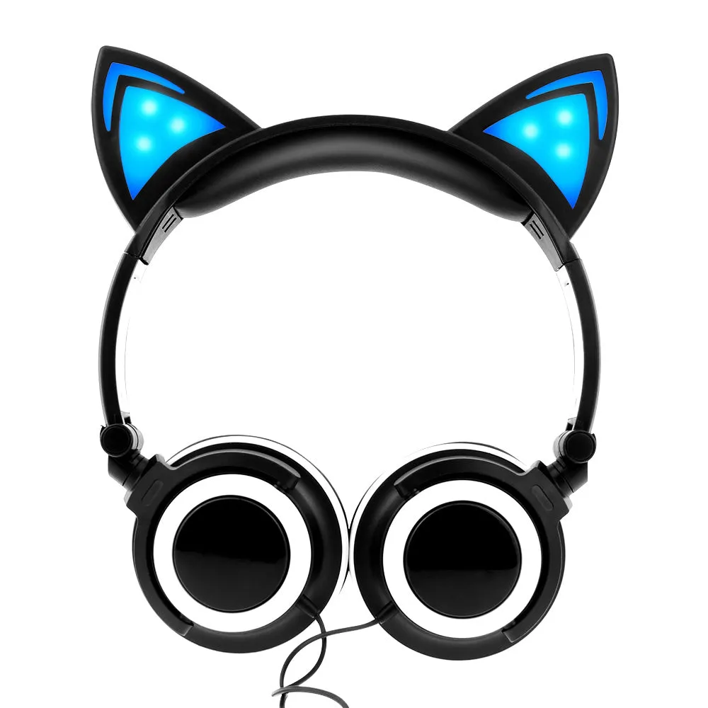Colourful LED cat ear headphones with illuminated ears and cushions on a dark background.