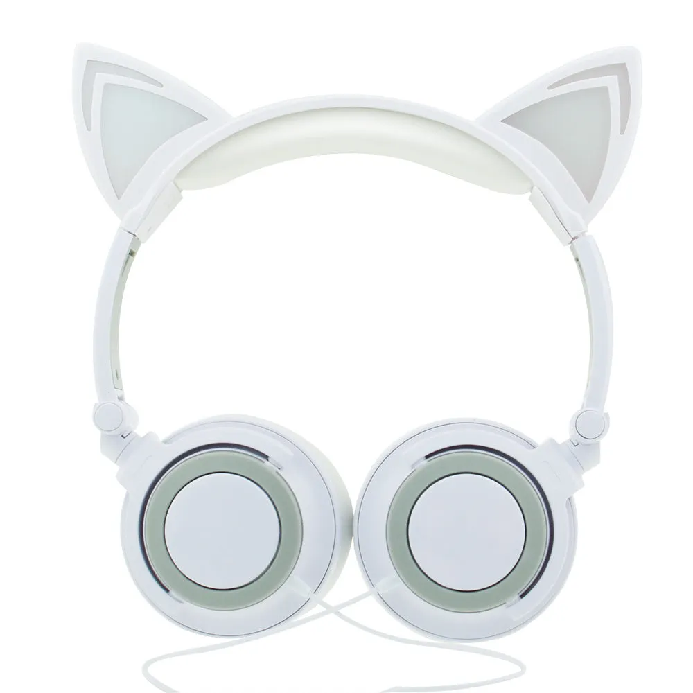 Colourful LED cat ear headphones with illuminated ears and cushions on a dark background.