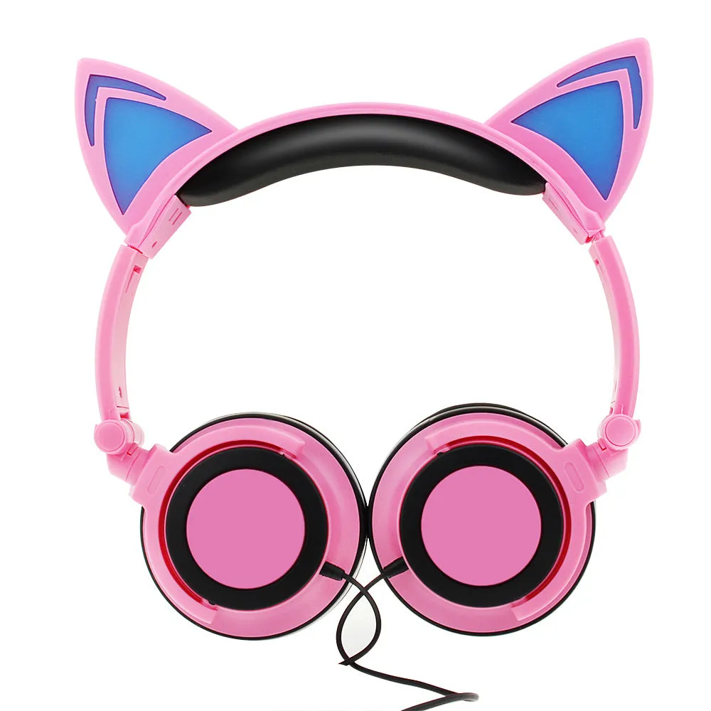 Colourful LED cat ear headphones with illuminated ears and cushions on a dark background.