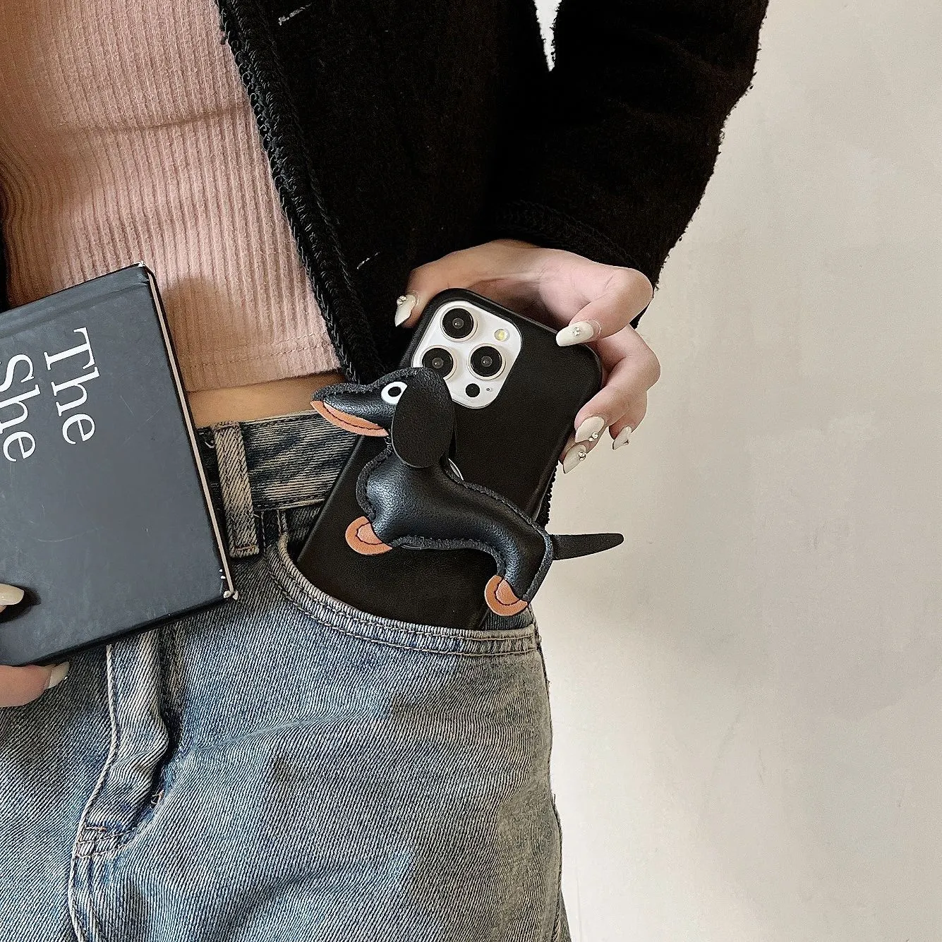 Sausage dog bracket phone case with imitation leather finish in black shell, compatible with iPhone models