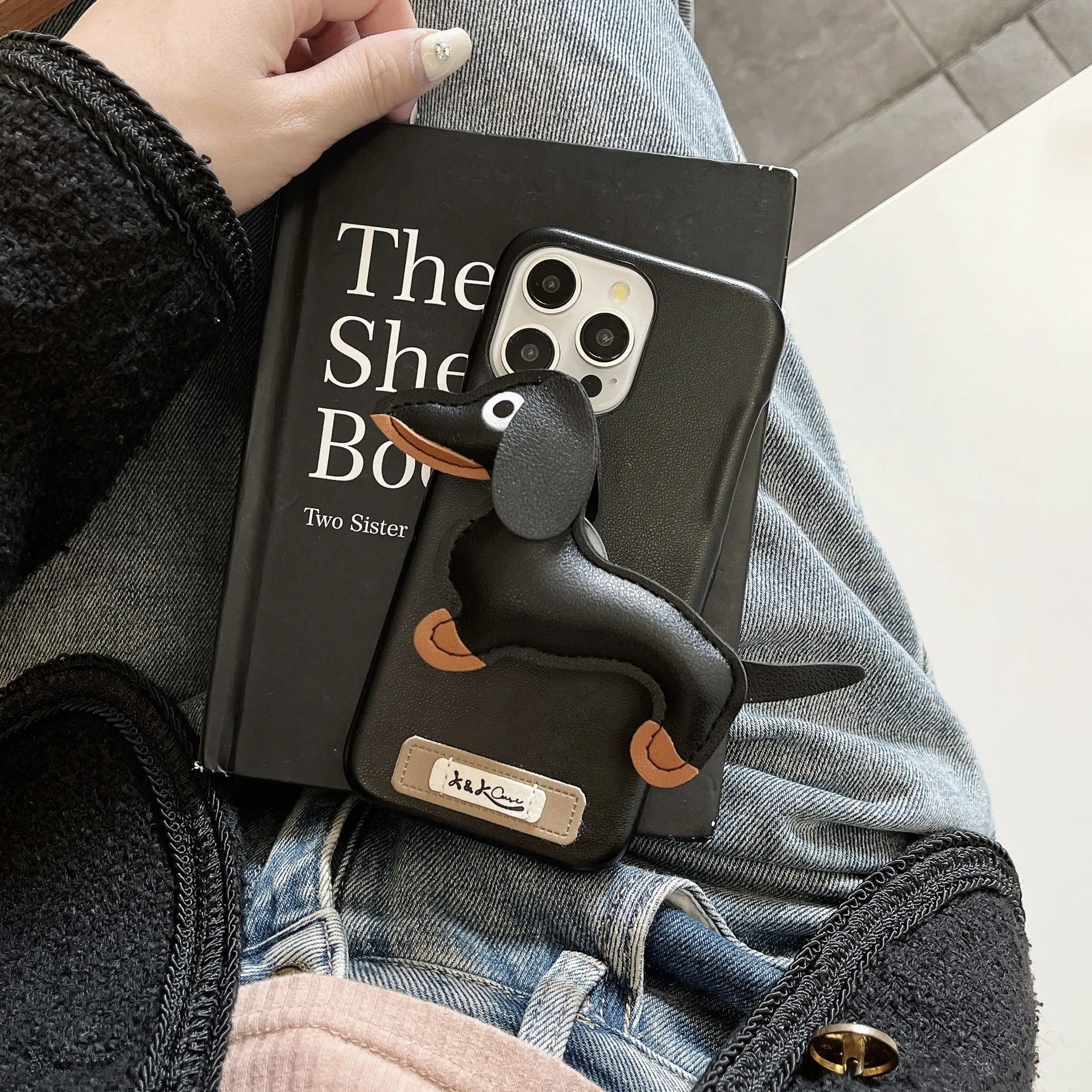 Sausage dog bracket phone case with imitation leather finish in black shell, compatible with iPhone models